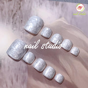 Elegant Pearlized White Press-On Toe Nails with Marble Effect